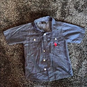 Blue button down shirt.